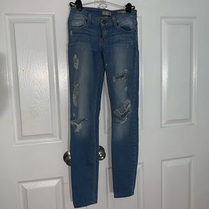 Guess ripped, low-rise, power skinny jeans. Size24